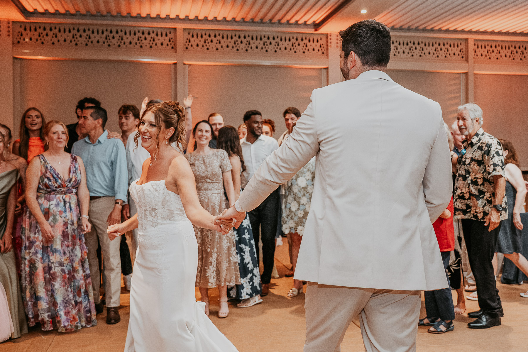 Newlywed couple dancing with wedding guests at Marriot Isla Verde wedding venue