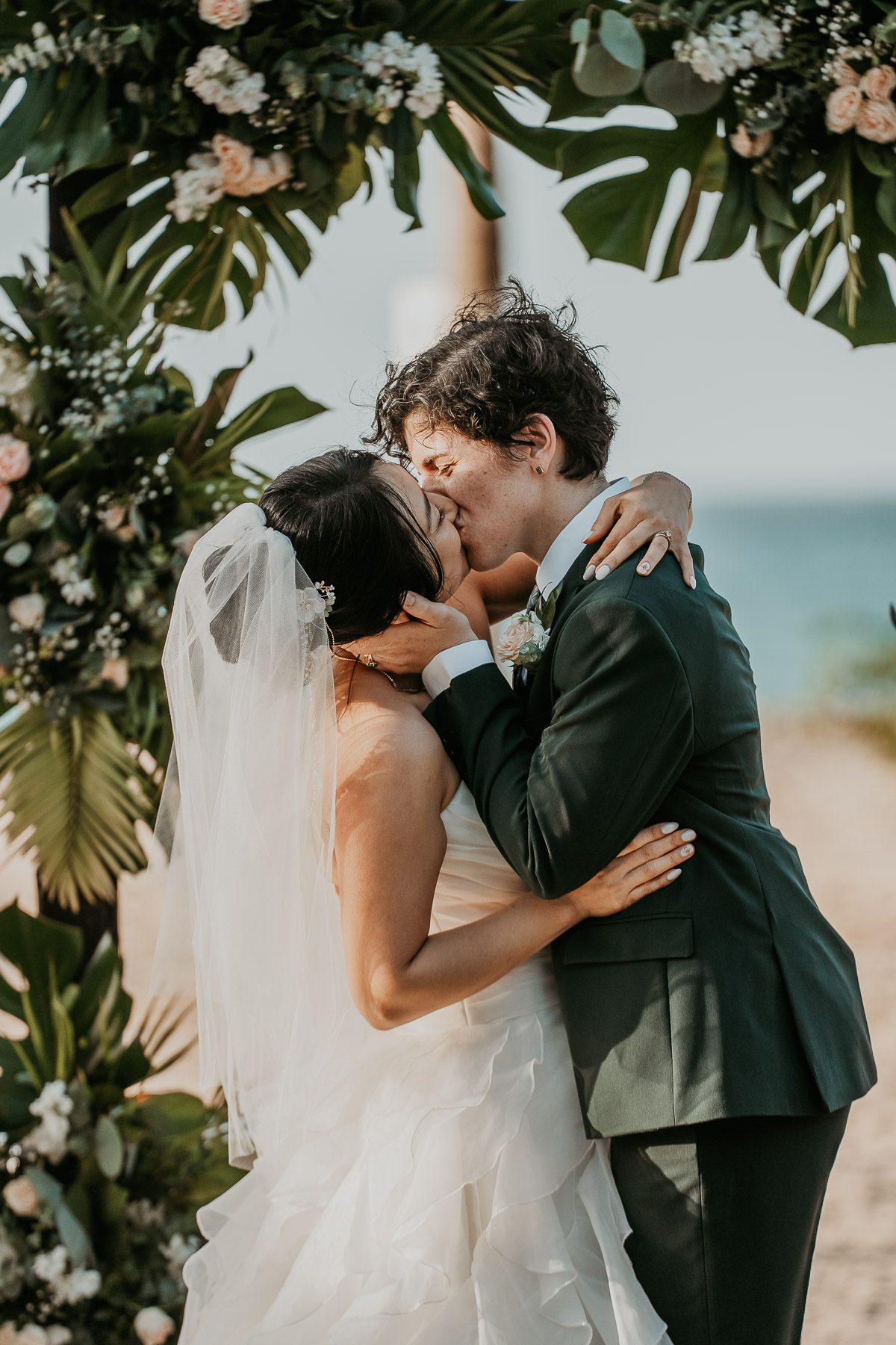 The newlyweds sharing their enthusiastic first kiss at the end of their ceremony.