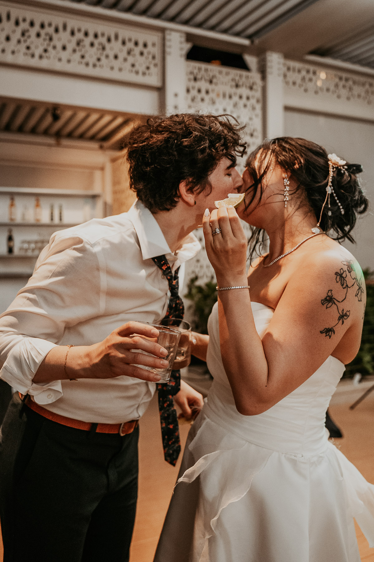Couple doing a tequila shot during their LGBTQ+ Wedding at the Courtyard Marriot.