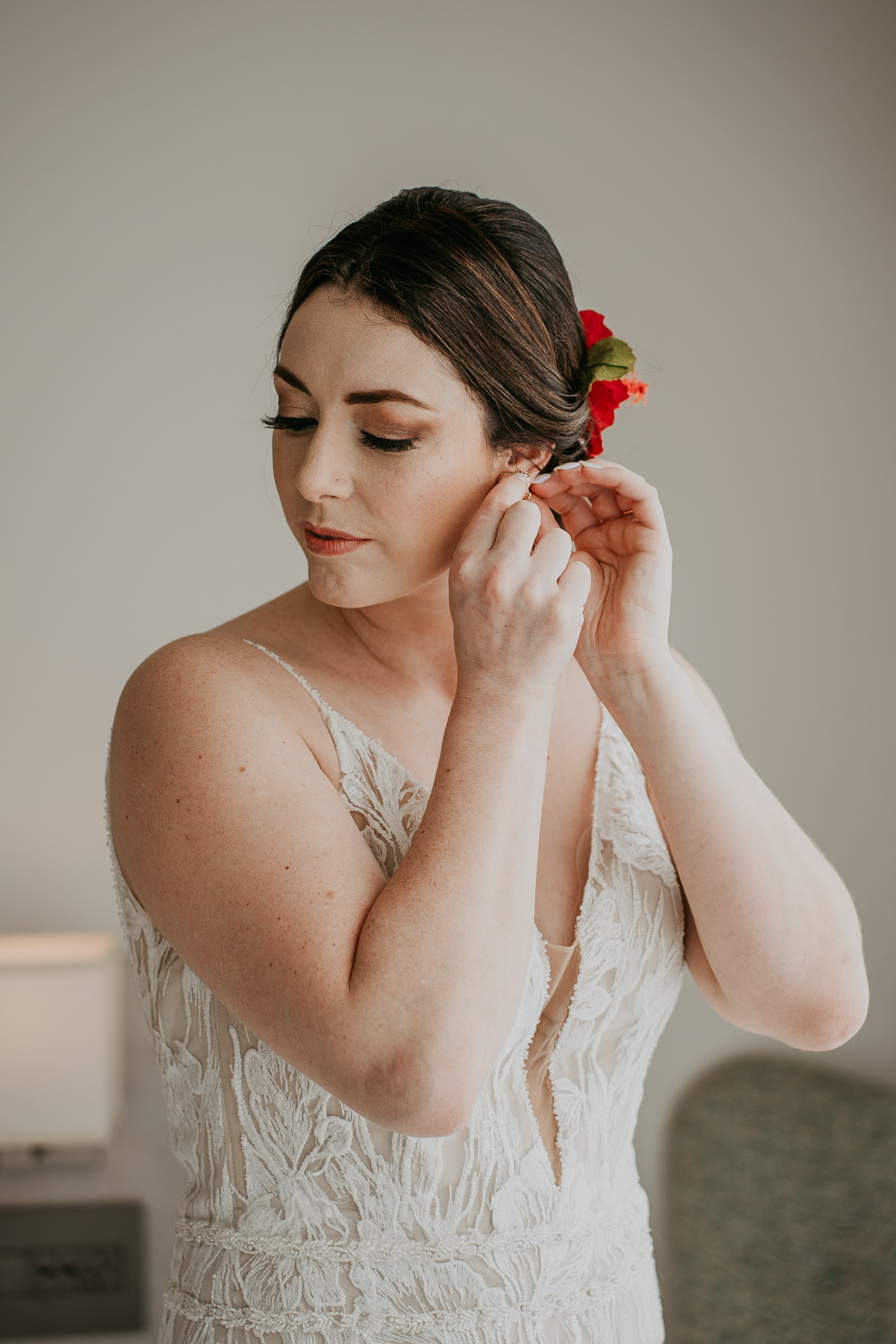 Bride putting on earing for her wedding at La Concha Resort.