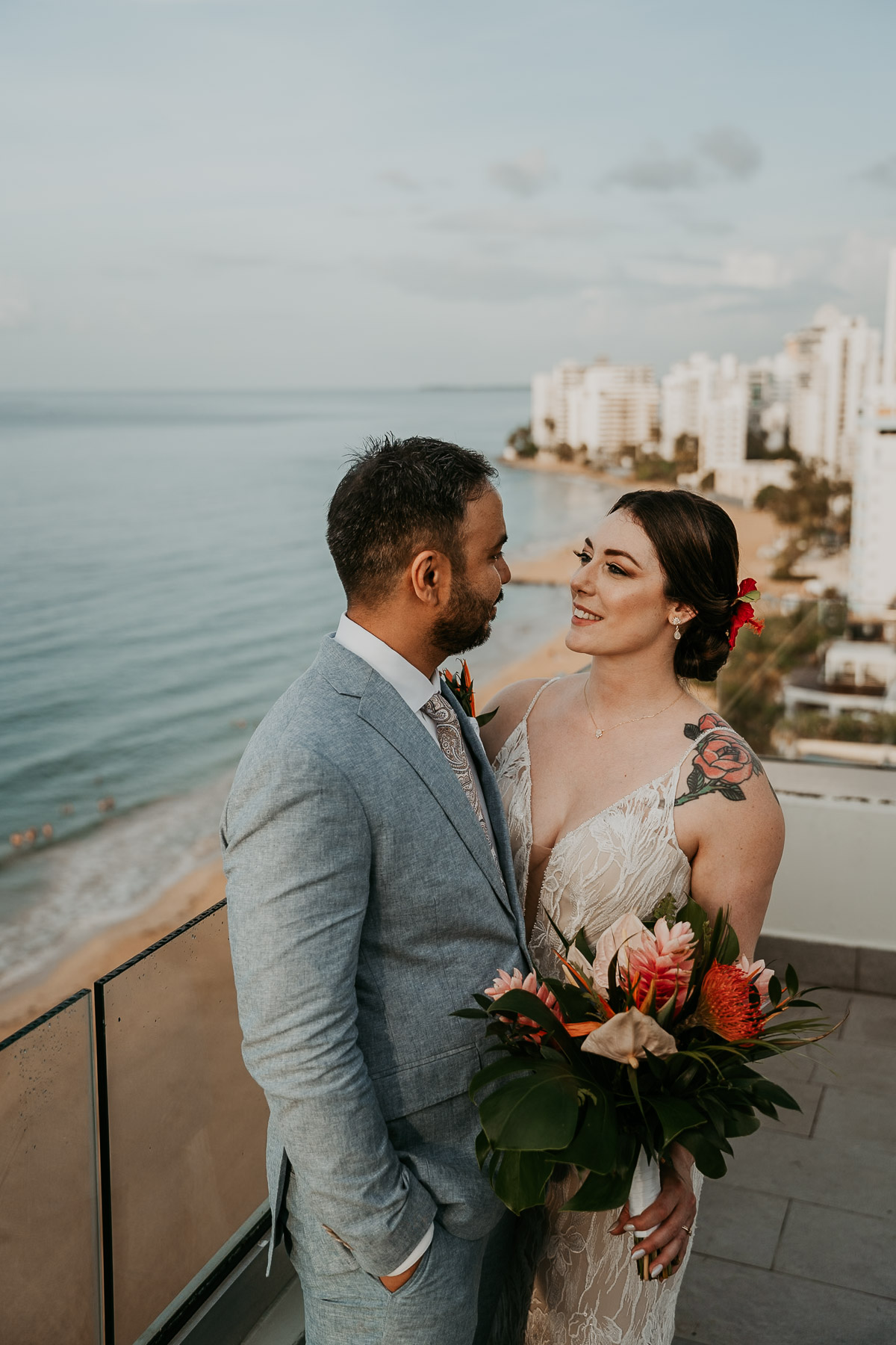 Bride and groom portraits on La Concha balcony with ocean backdrop