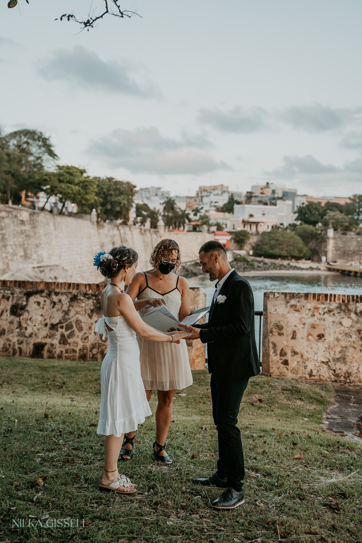 Couple exchanging rings during Old San Juan Elopement