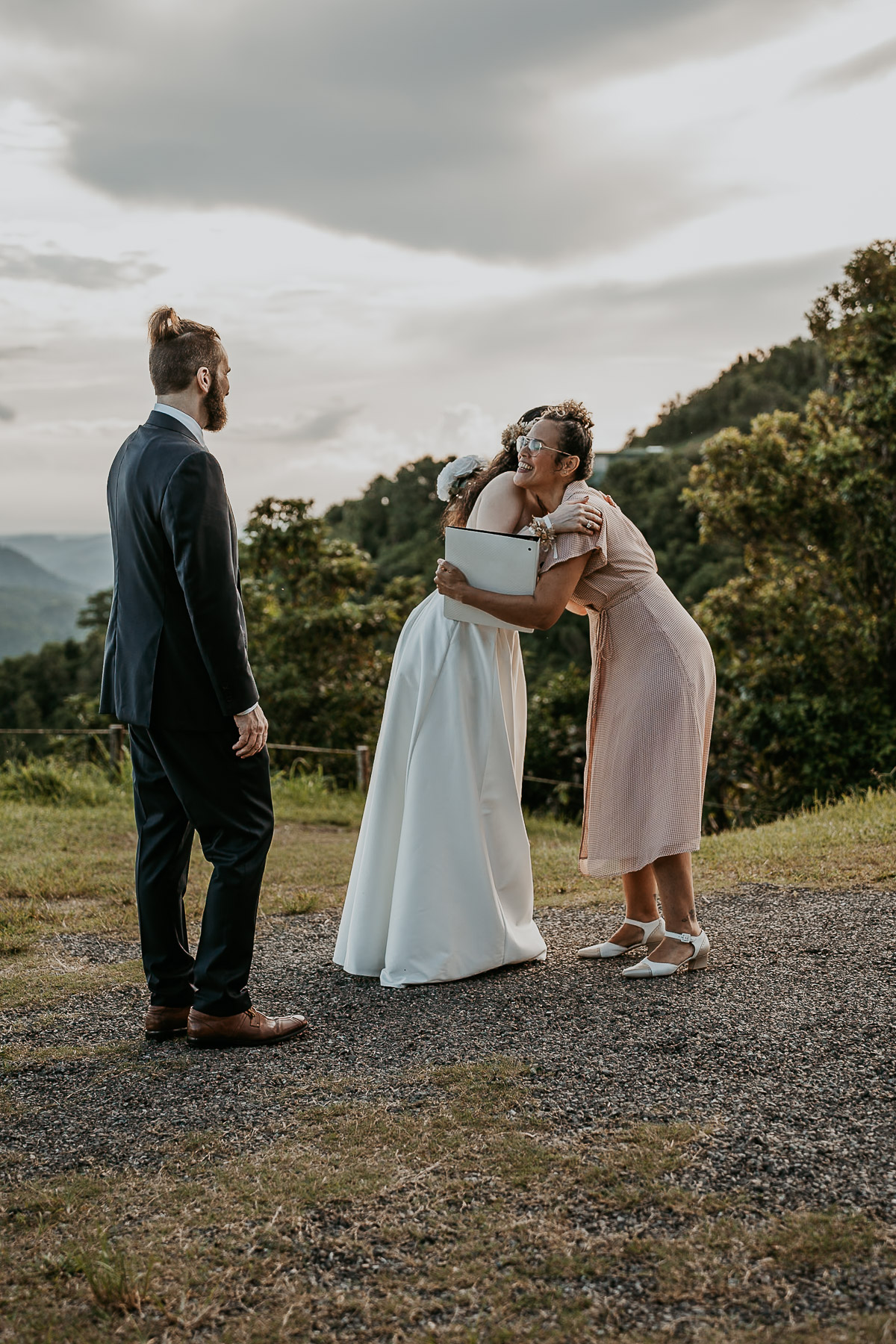 Happy moment between bride and officiant during their elpement in Puerto Rico.