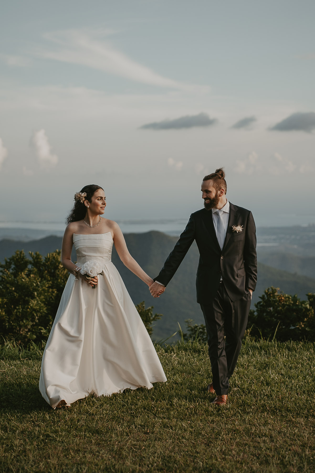 Panoramic view of the couple standing at a mountain overlook in Cayey.