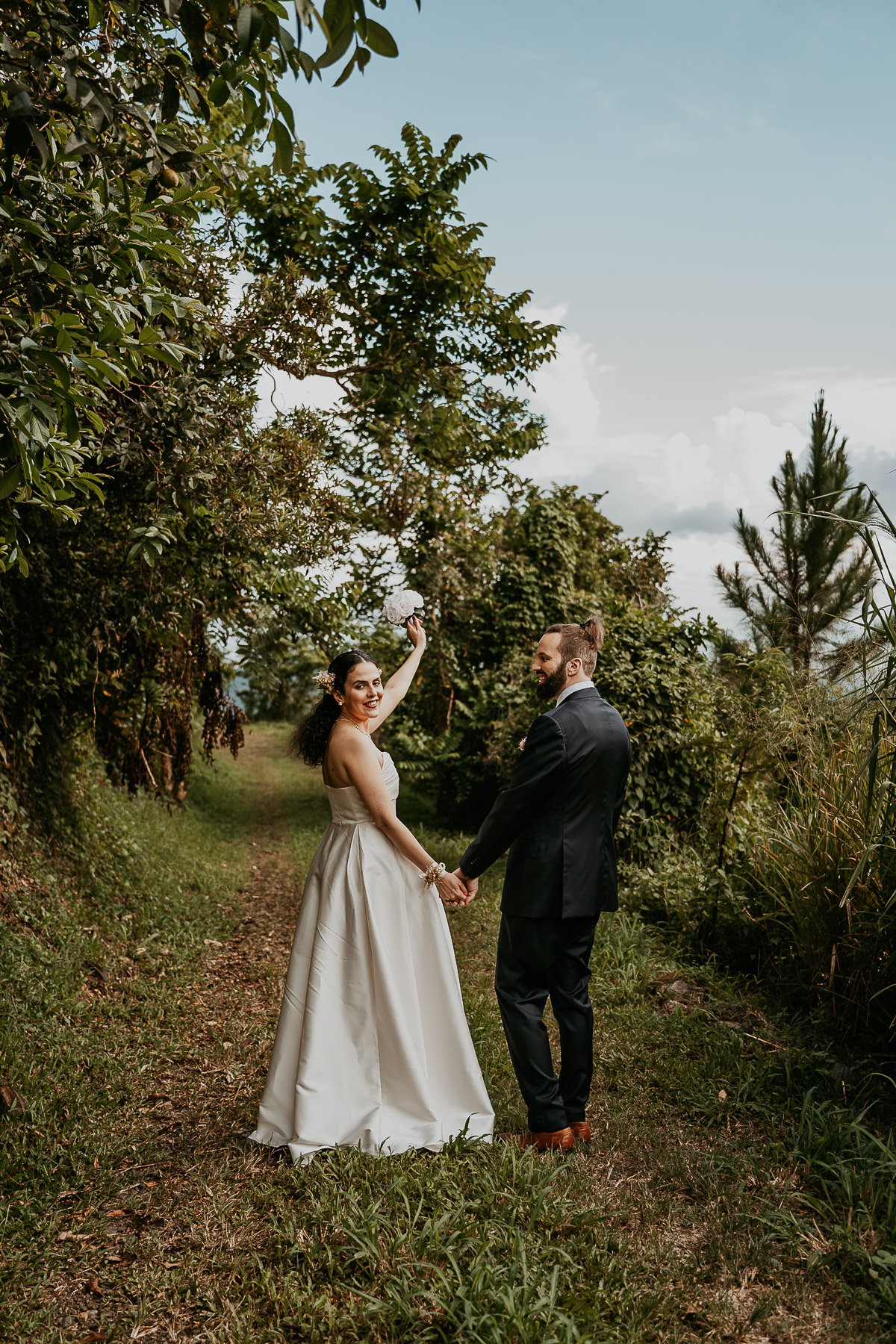 Couple enjoying the peaceful trails at their off-the-beaten-path elopement in Cayey.