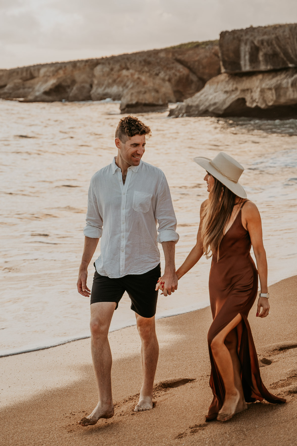 Candid laughter as a couple walks along the shoreline in Puerto Rico.