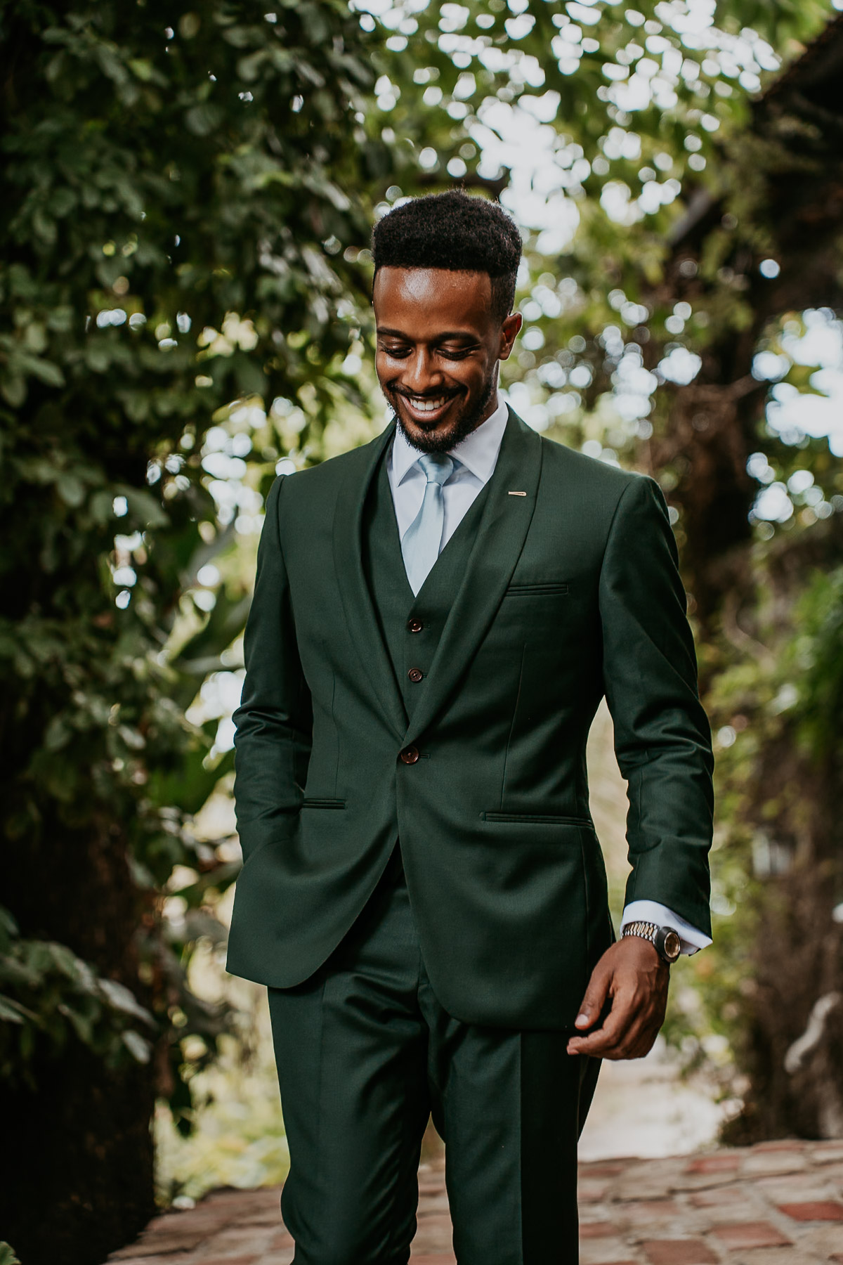 Groom smiling during his getting ready at Hacienda Siesta Alegre.