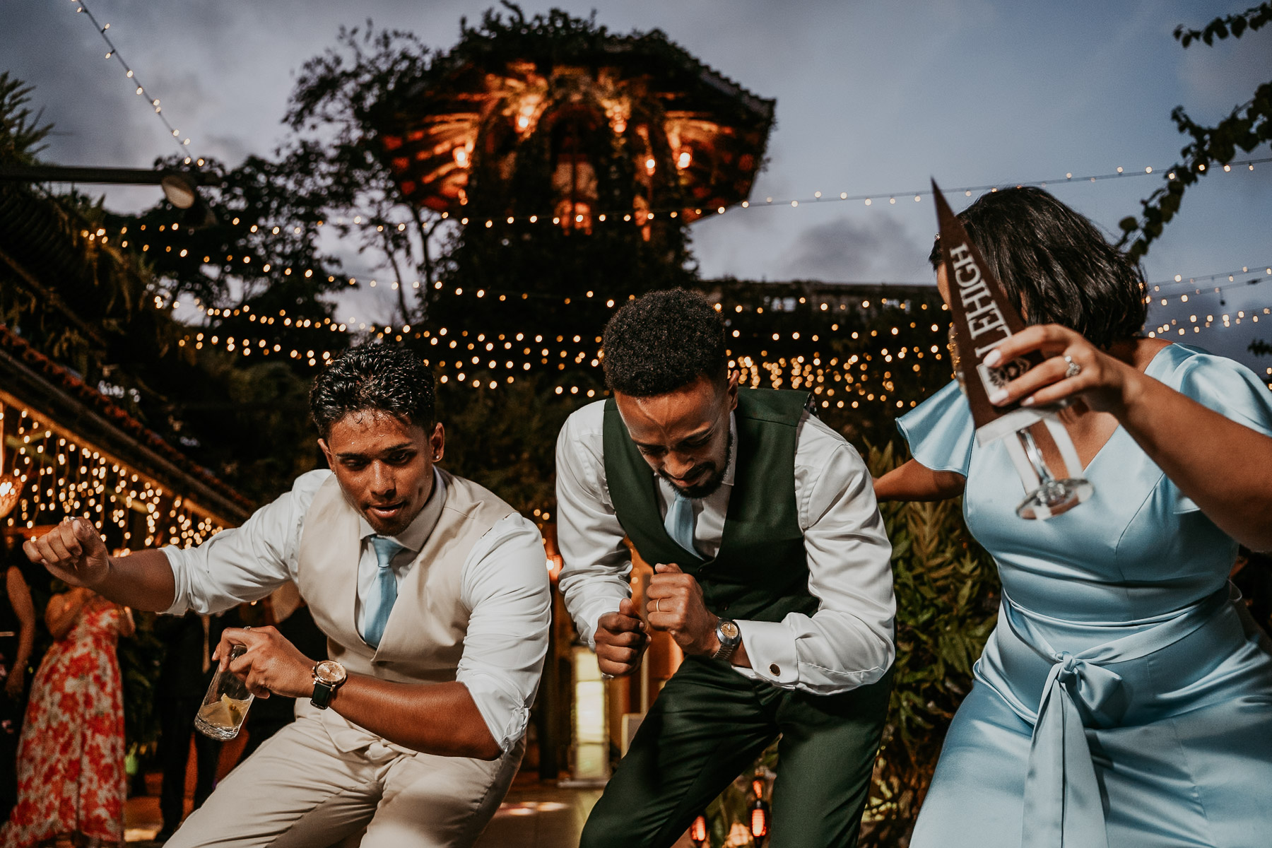 Candid moment of groom dancing with his guests.