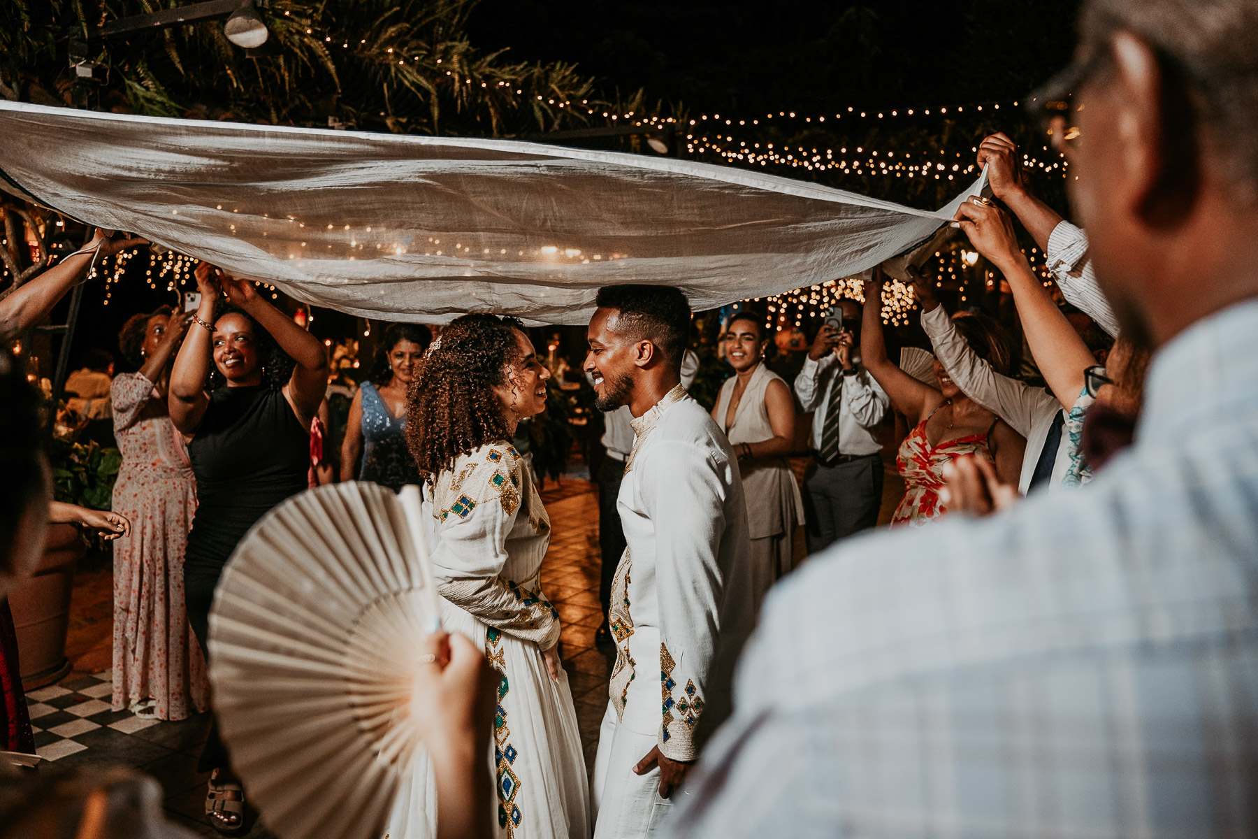 Bride and groom dancing Ethiopian music.