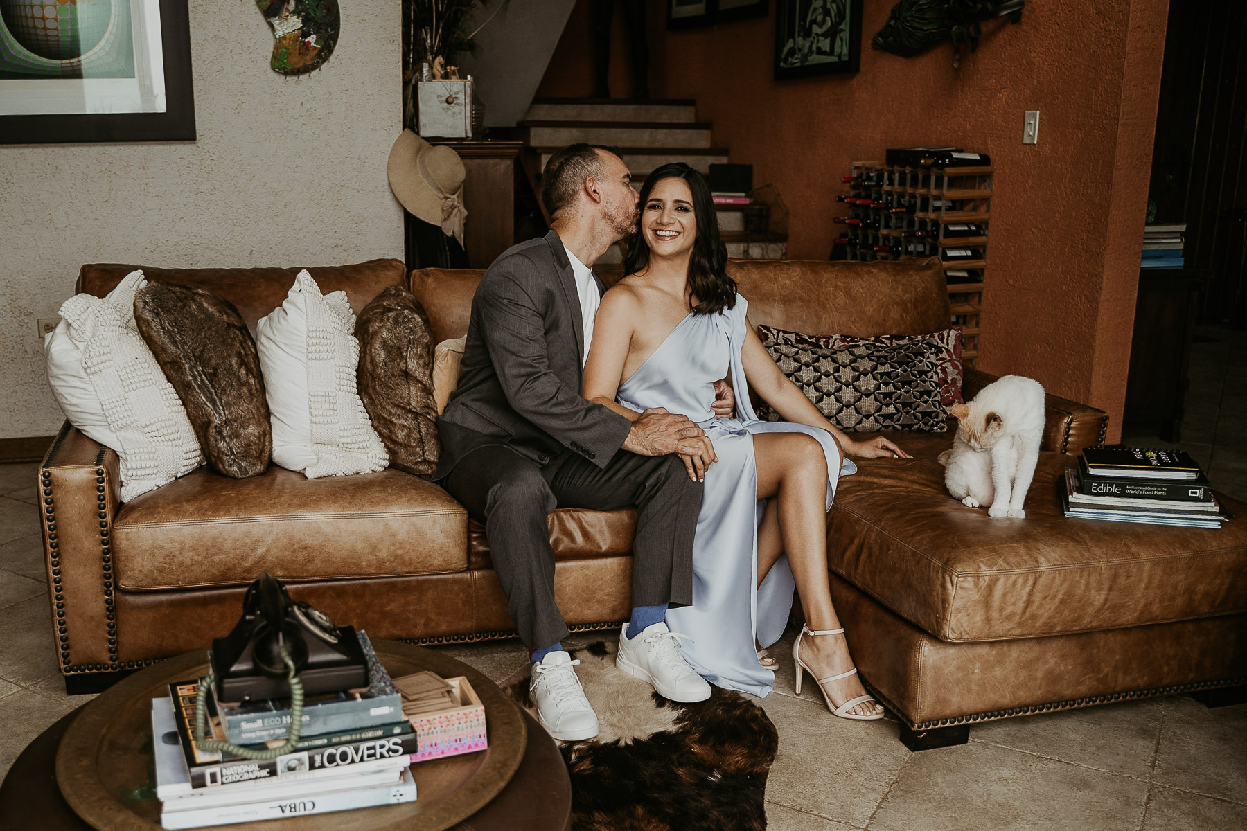 A couple embracing in the living room of Mont Carpe Diem in Puerto Rico.