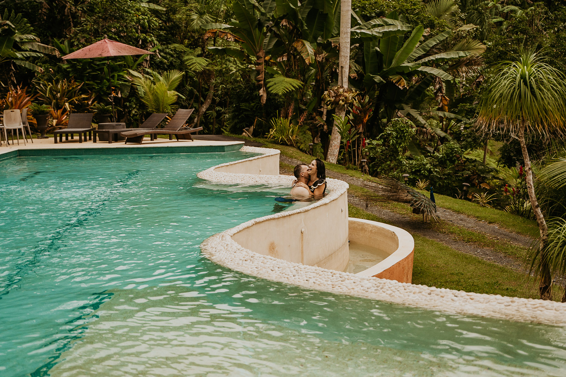 Candid shot of a couple in the pool of Mont Carpe Diem during their couples session. in Puerto Rico.