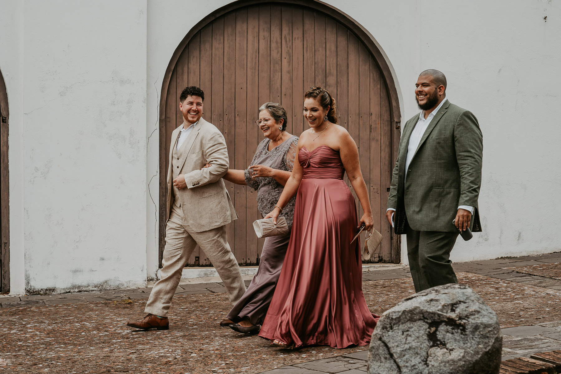 Groom walking with family for his wedding at Museo Casa Blanca