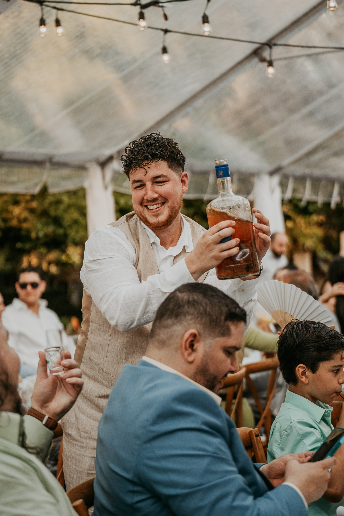 Groom serving pitorro