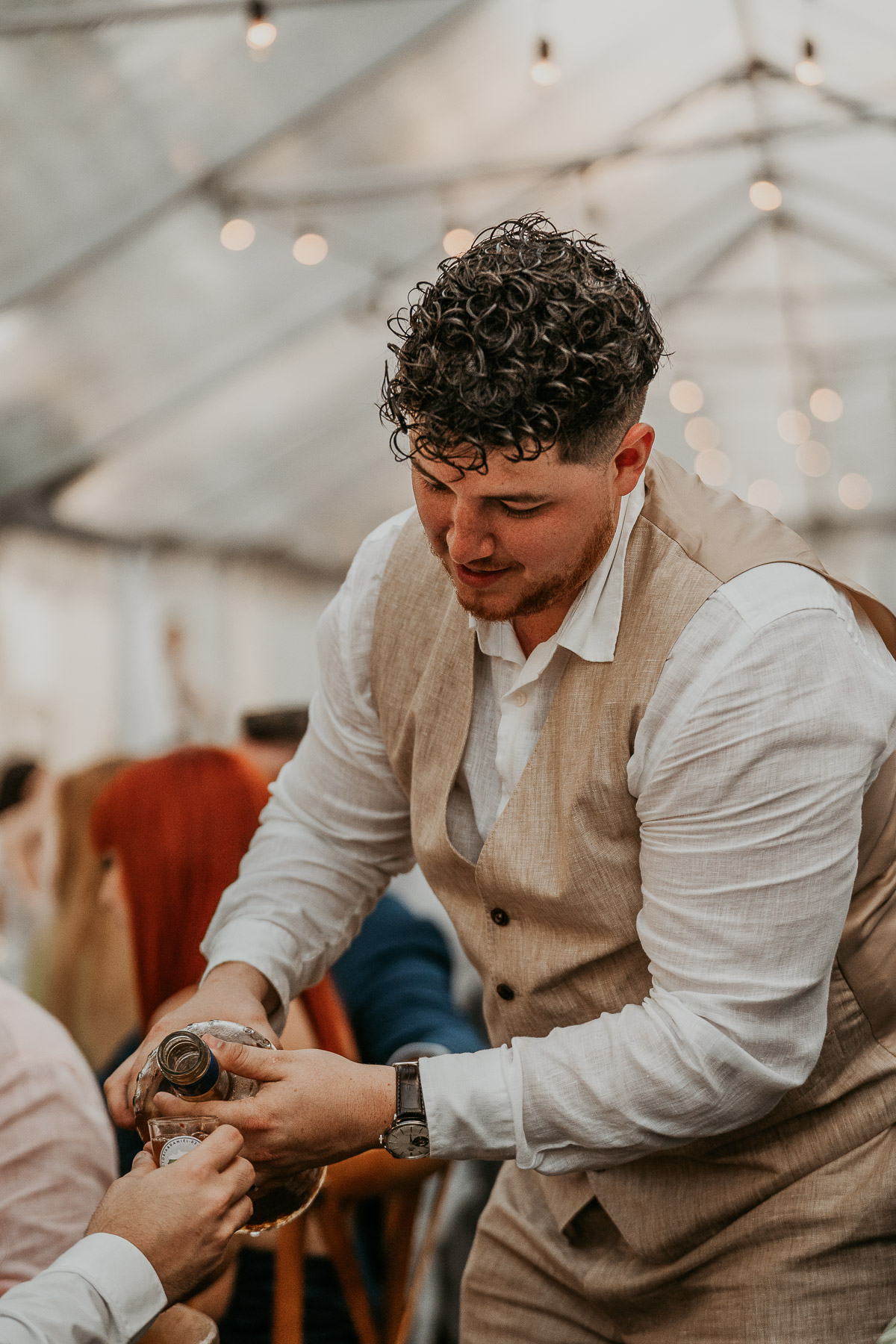 Groom serving pitorro