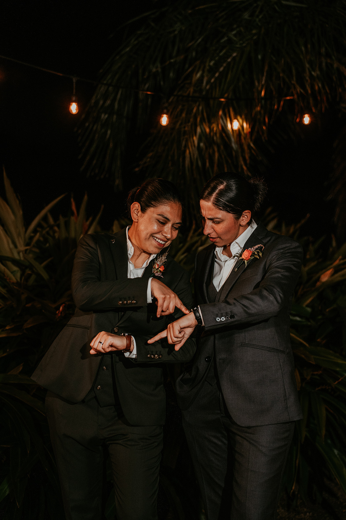 Bride and best woman exchange candid moment.