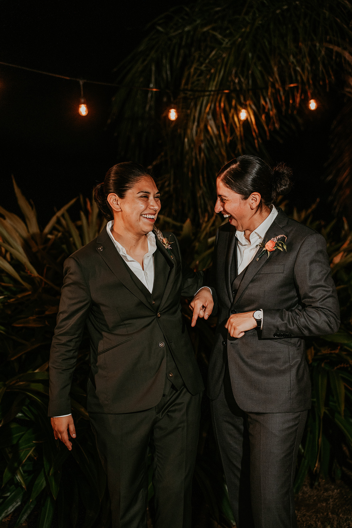 Bride and best woman exchange candid moment.