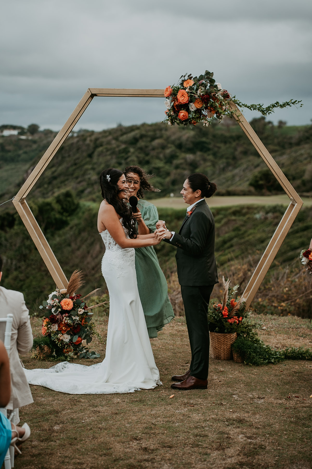 LGBTQ+ wedding ceremony at Royal Isabela golf course with dramatic ocean views in Puerto Rico.