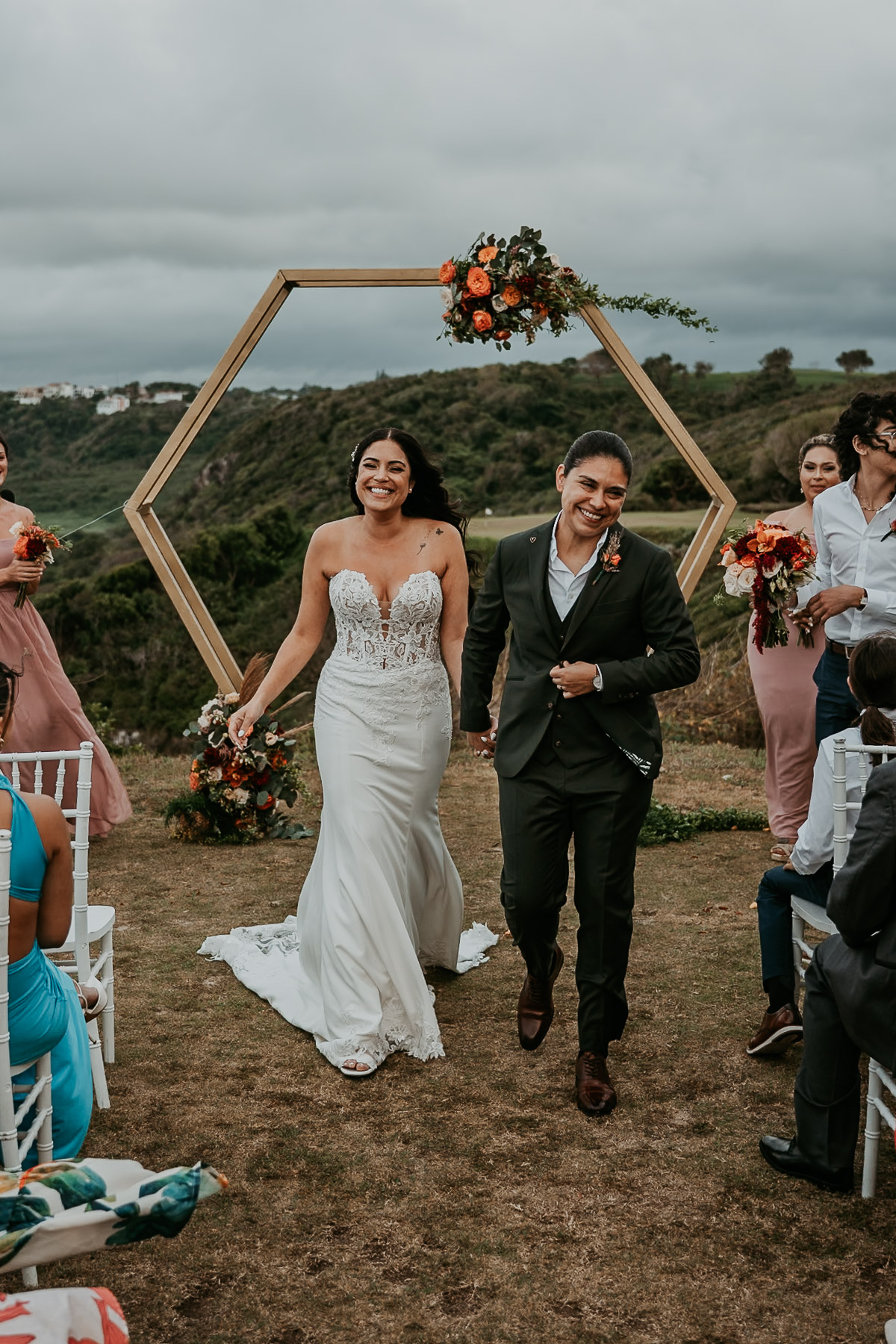 LGBTQ+ wedding ceremony at Royal Isabela golf course with dramatic ocean views in Puerto Rico.