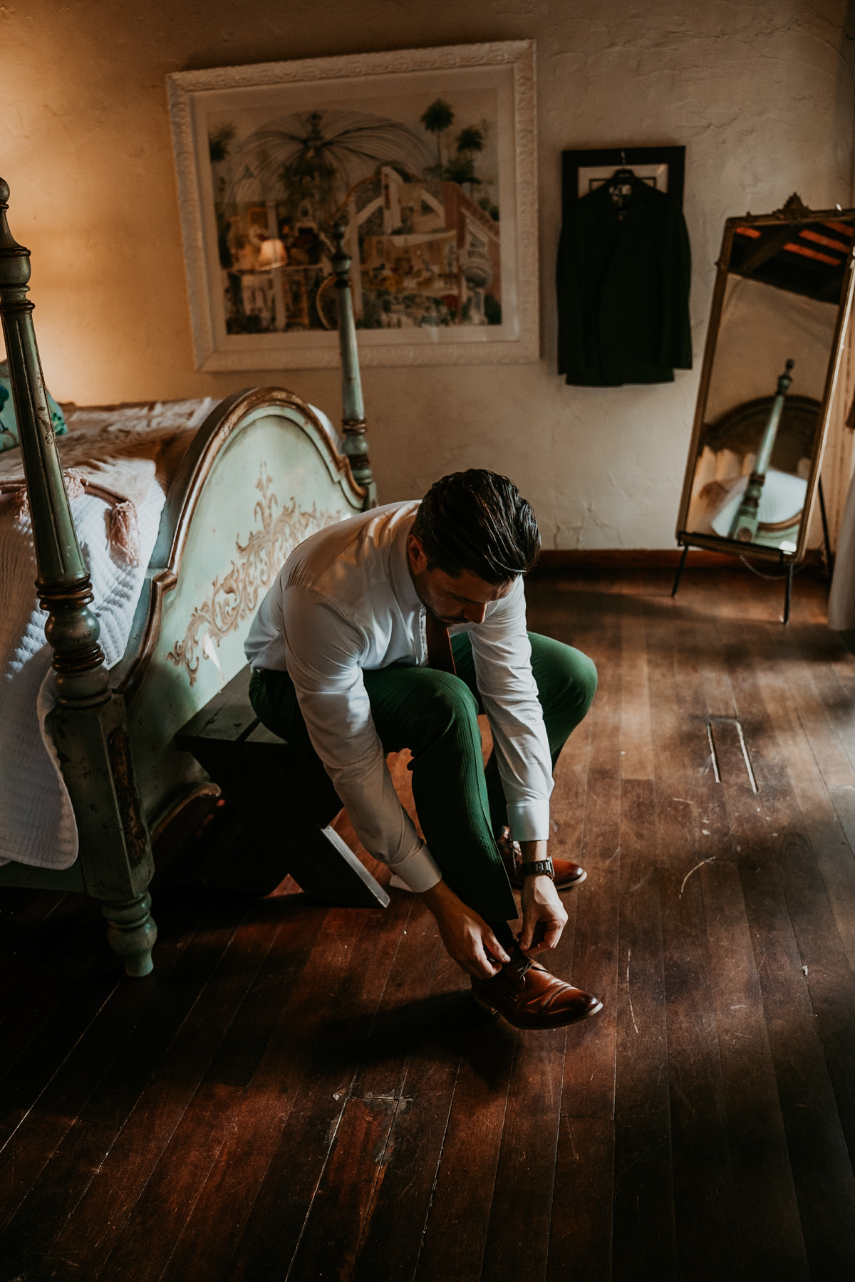 Groom putting on shoes