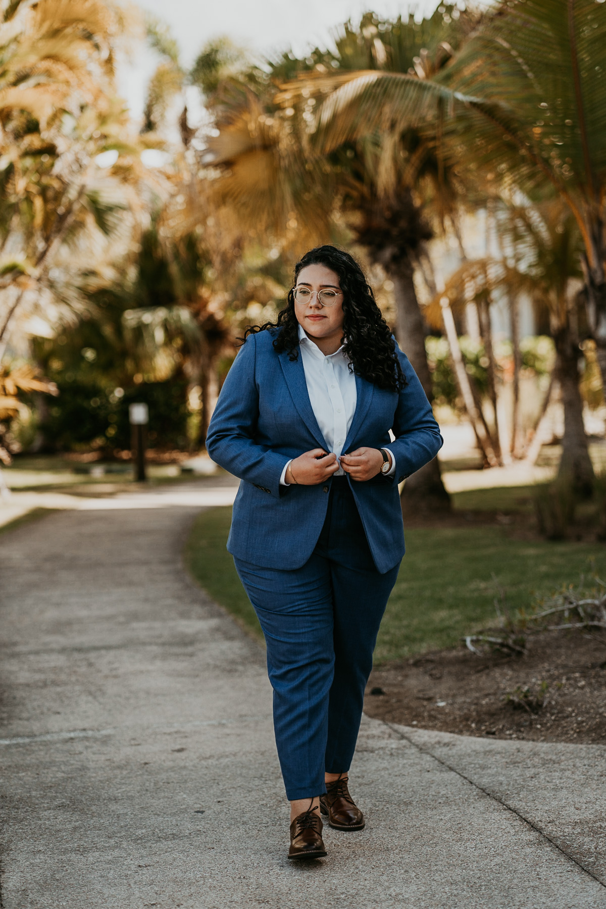 Bride walking showing off Bindle and Keep Blue Suit.