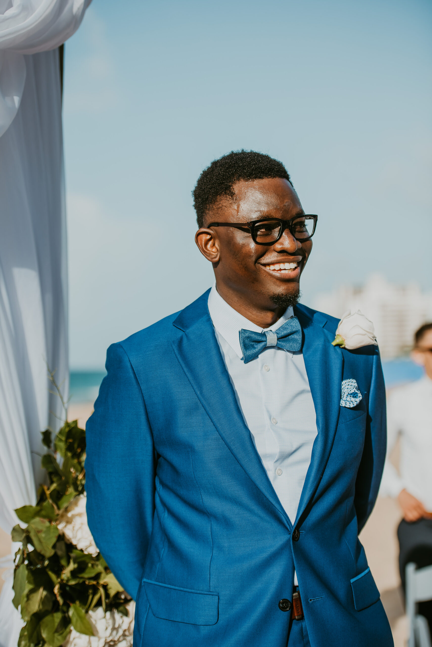 Groom smiles as he waits for his bride on the beach at La Concha Resort Wedding.