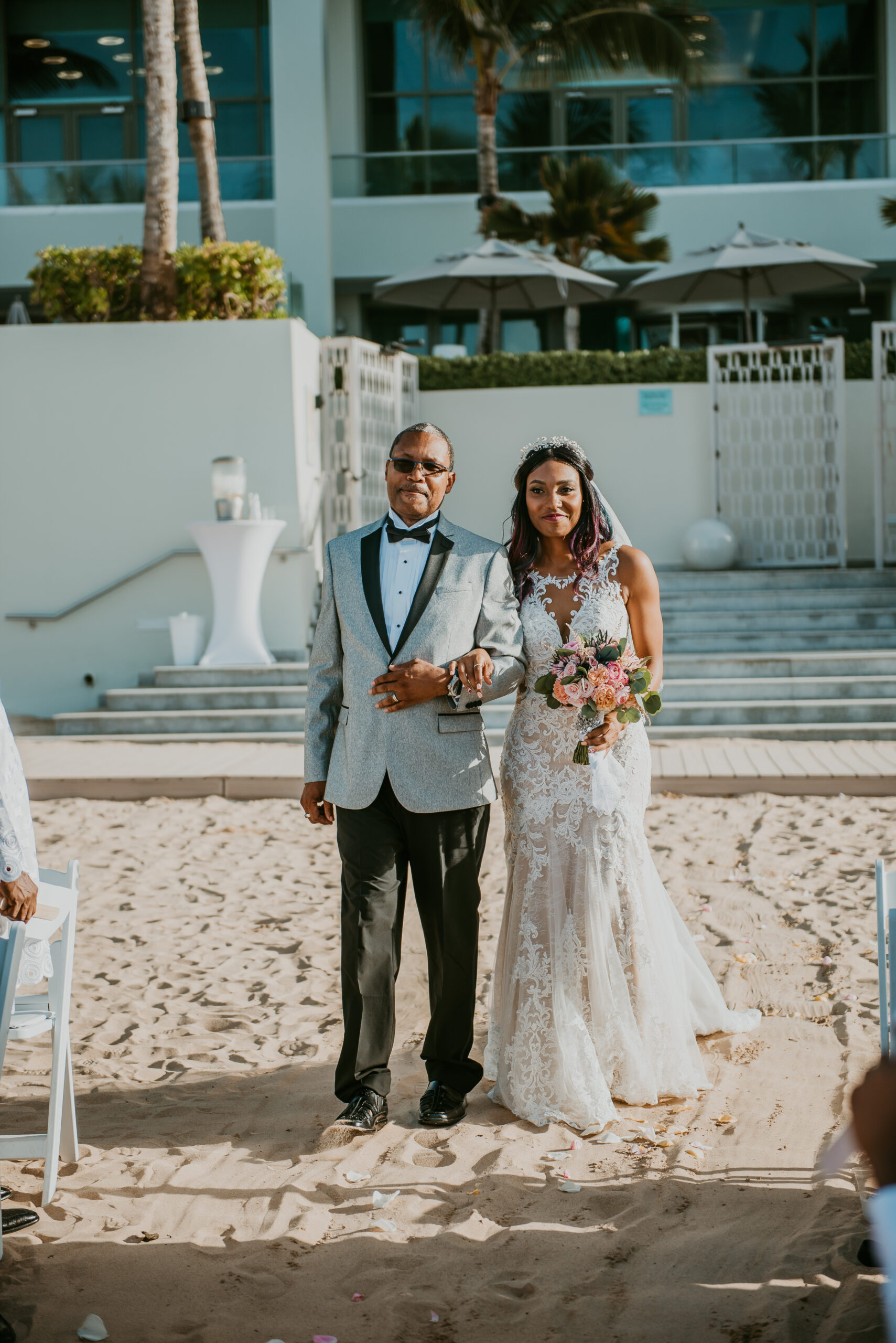 Bride walking towards groom at La Concha Resort Beach wedding.