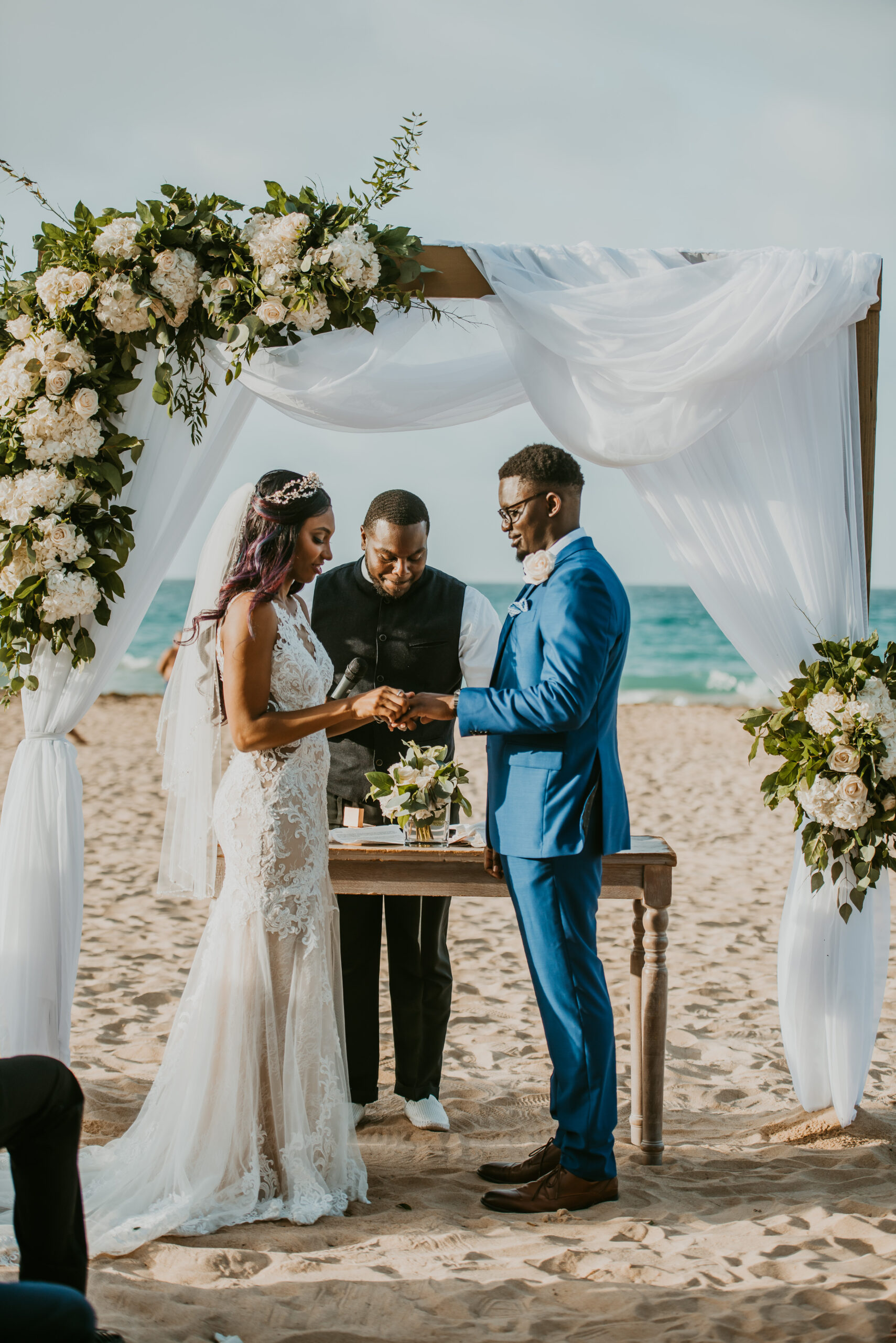 Romantic beach wedding ceremony at La Concha Resort, Puerto Rico, with ocean backdrop.