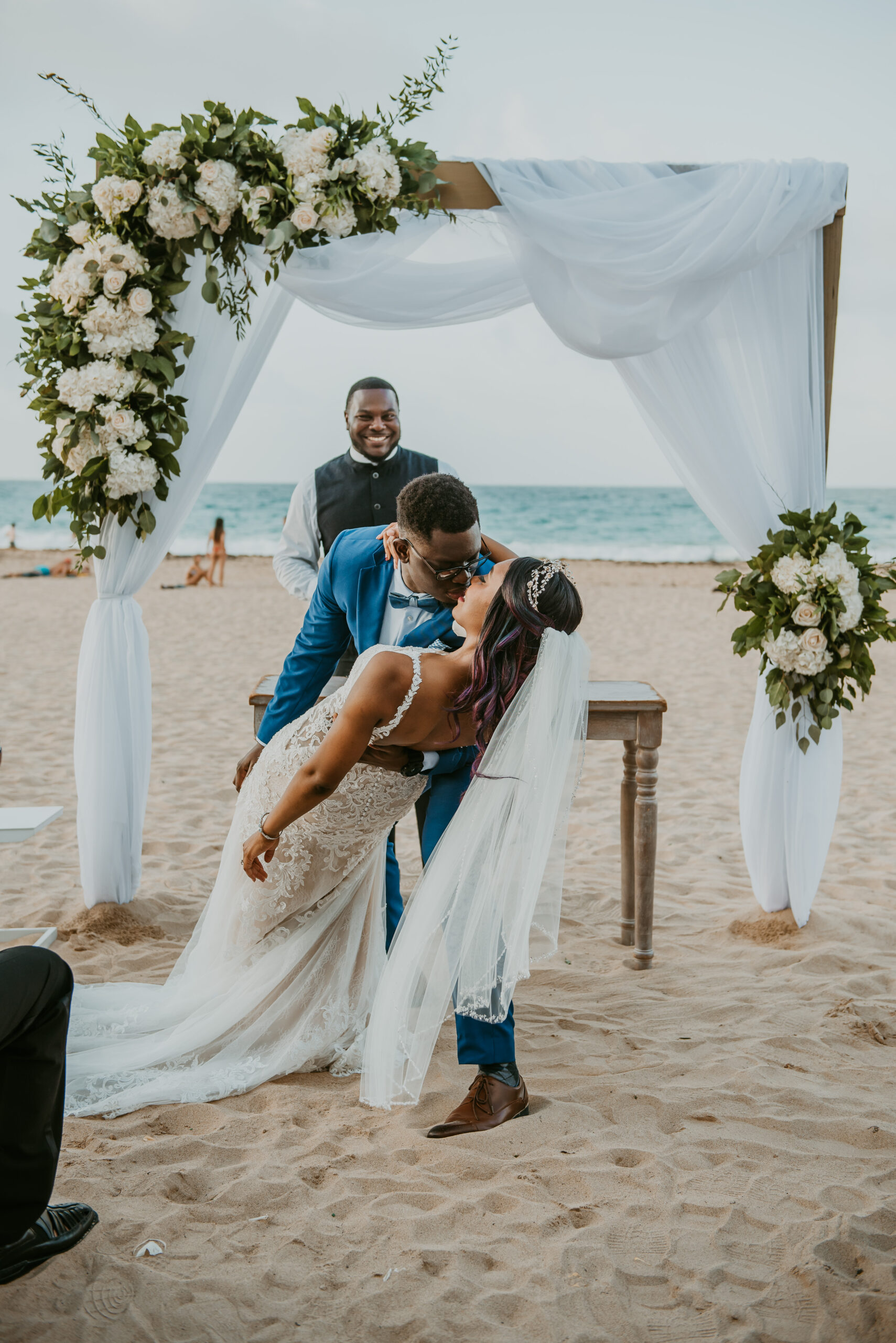 Romantic beach wedding ceremony at La Concha Resort, Puerto Rico, with ocean backdrop.