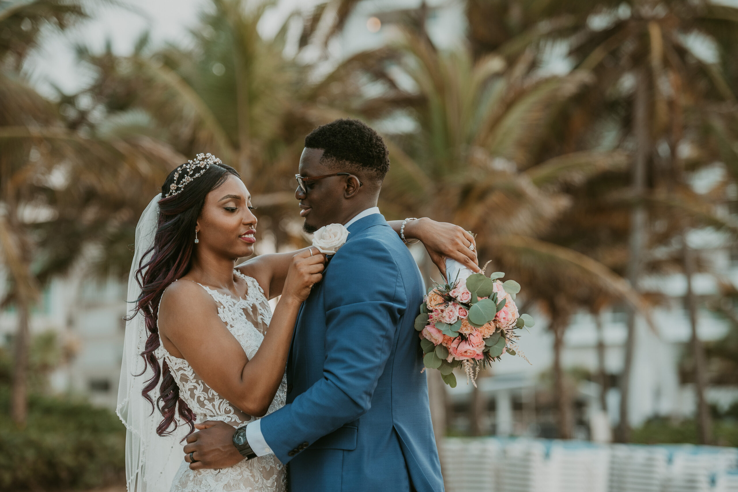 Romantic beach bride and groom portraits at La Concha Resort, Puerto Rico, with ocean backdrop.