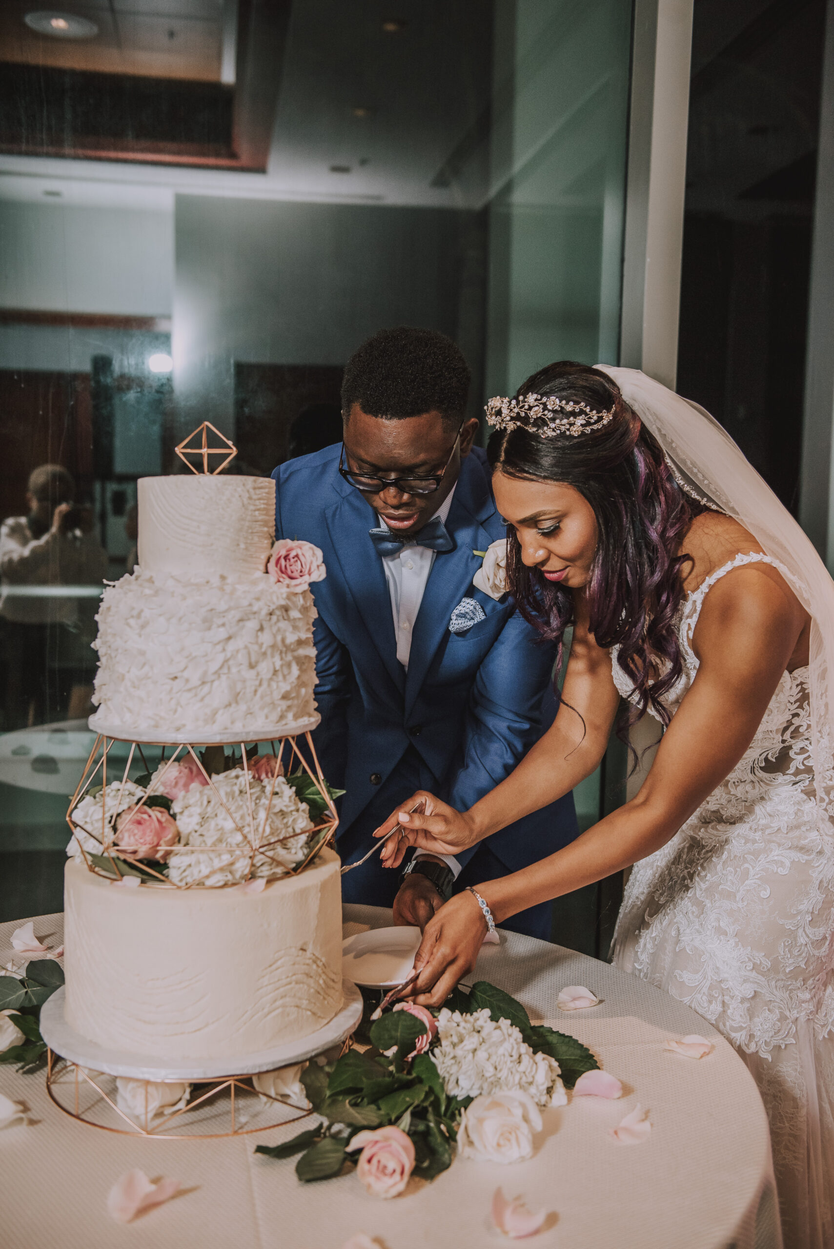 Bride and groom cutting cake at Salon Atlantiko Wedding at La Concha Resort.