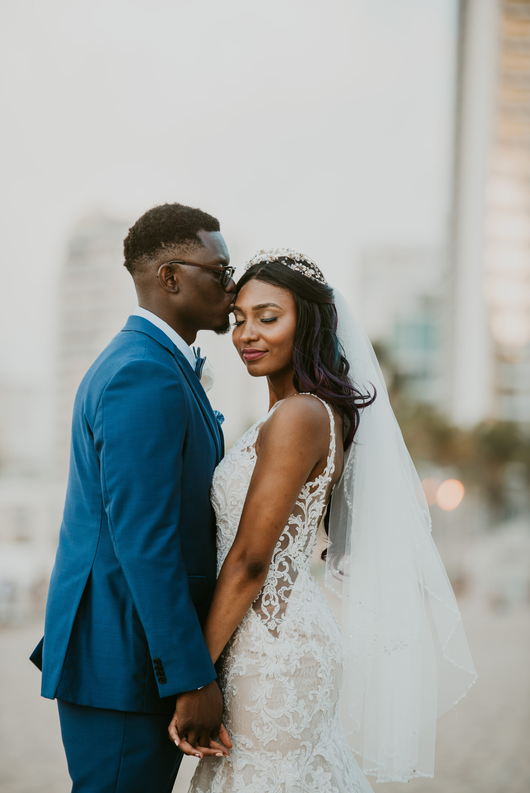 Romantic beach bride and groom portraits at La Concha Resort, Puerto Rico, with ocean backdrop.