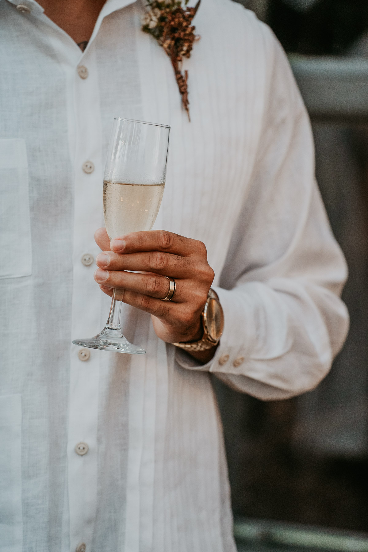 Groom holding champagne after elopement ceremony in El Pretexto Puerto Rico