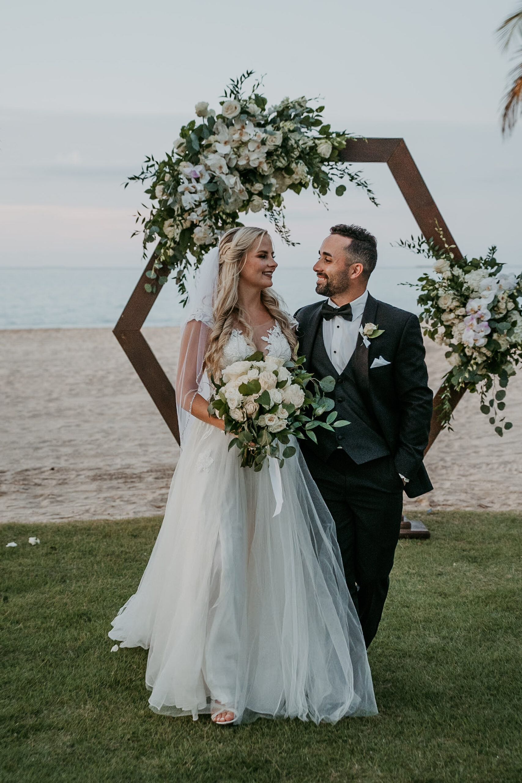 Wedding couple walking along the beach near the Courtyard Marriott in Puerto Rico