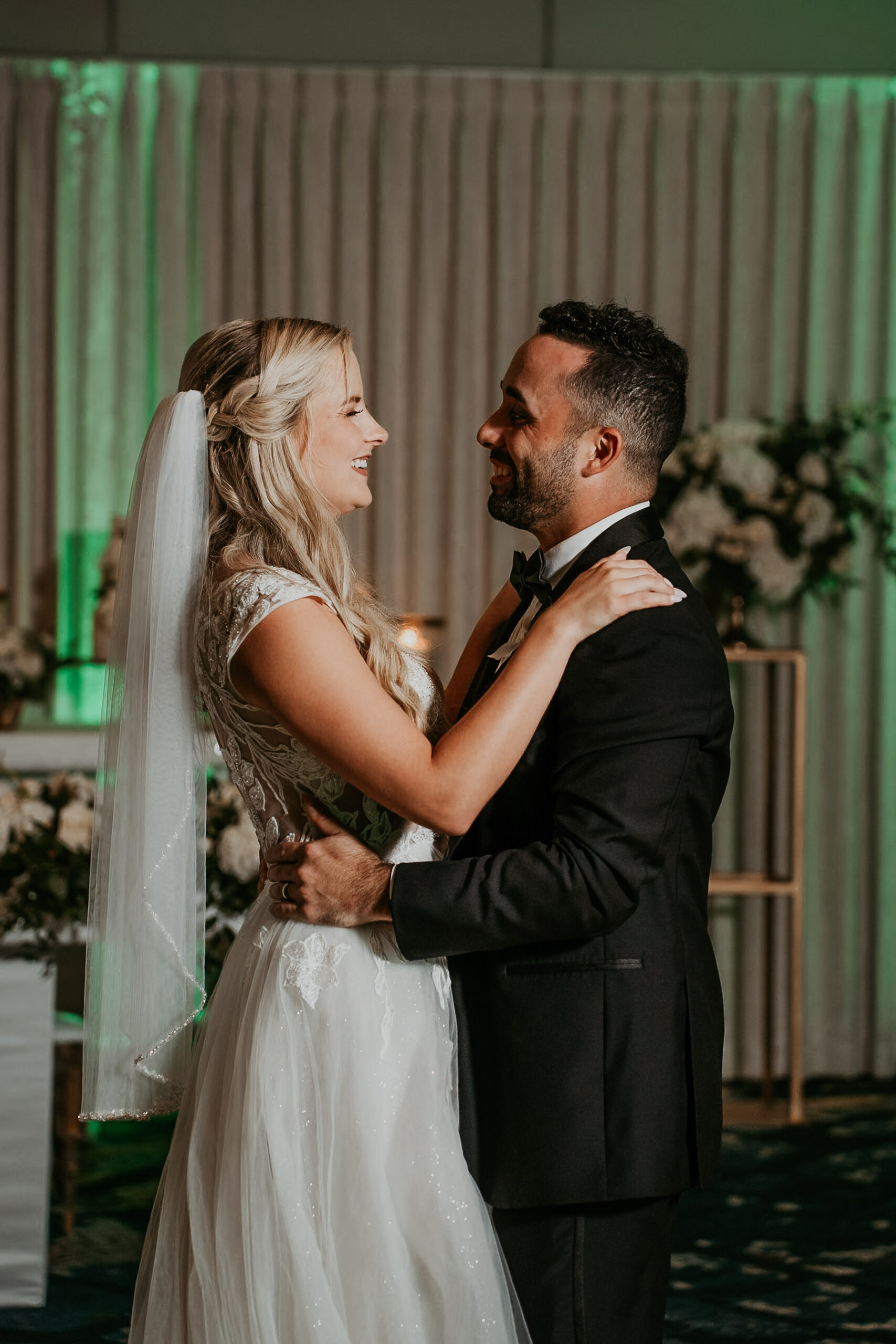 Romantic first dance of bride and groom at Salon del Mar with soft lighting at Courtyard Marriott Puerto Rico