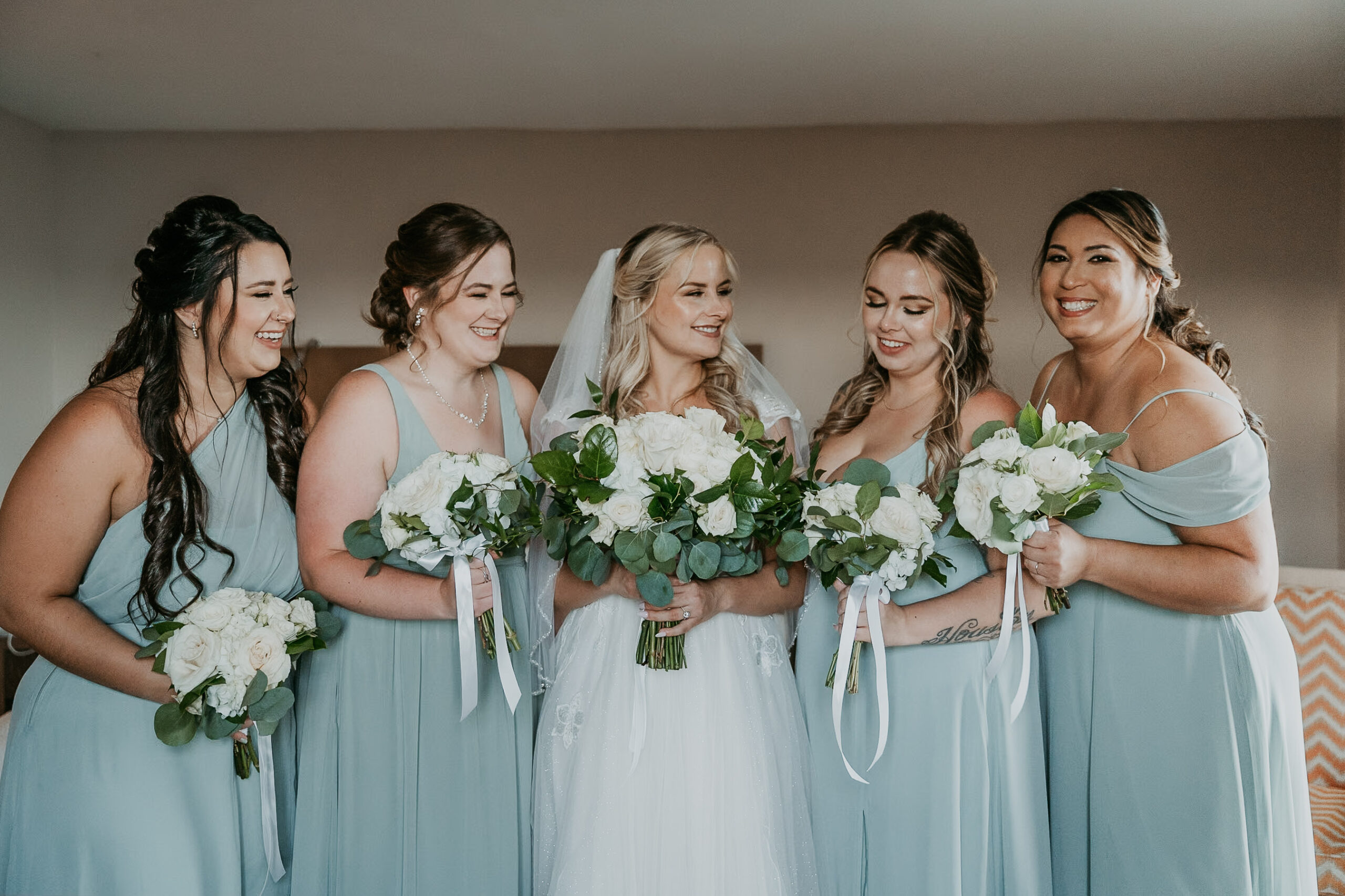 Bride and bridesmaids candid photo at Courtyard Marriot