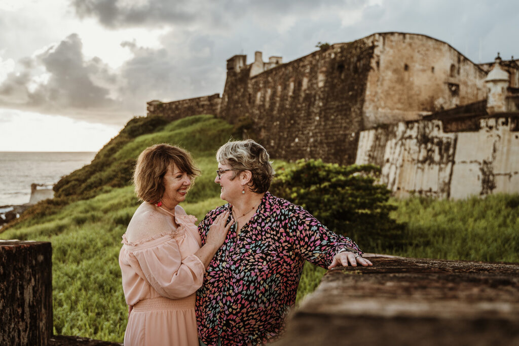 Lesbian couple proposal near Castillo San Cristóbal in Old San Juan Puerto Rico, LGBTQ love story with historic backdrop and inclusive wedding photography