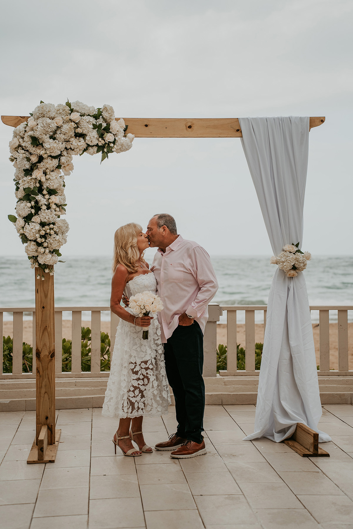 Older couple elopement at Marriott Stellaris San Juan Puerto Rico, intimate beach wedding highlighting weddings later in life and meaningful connection