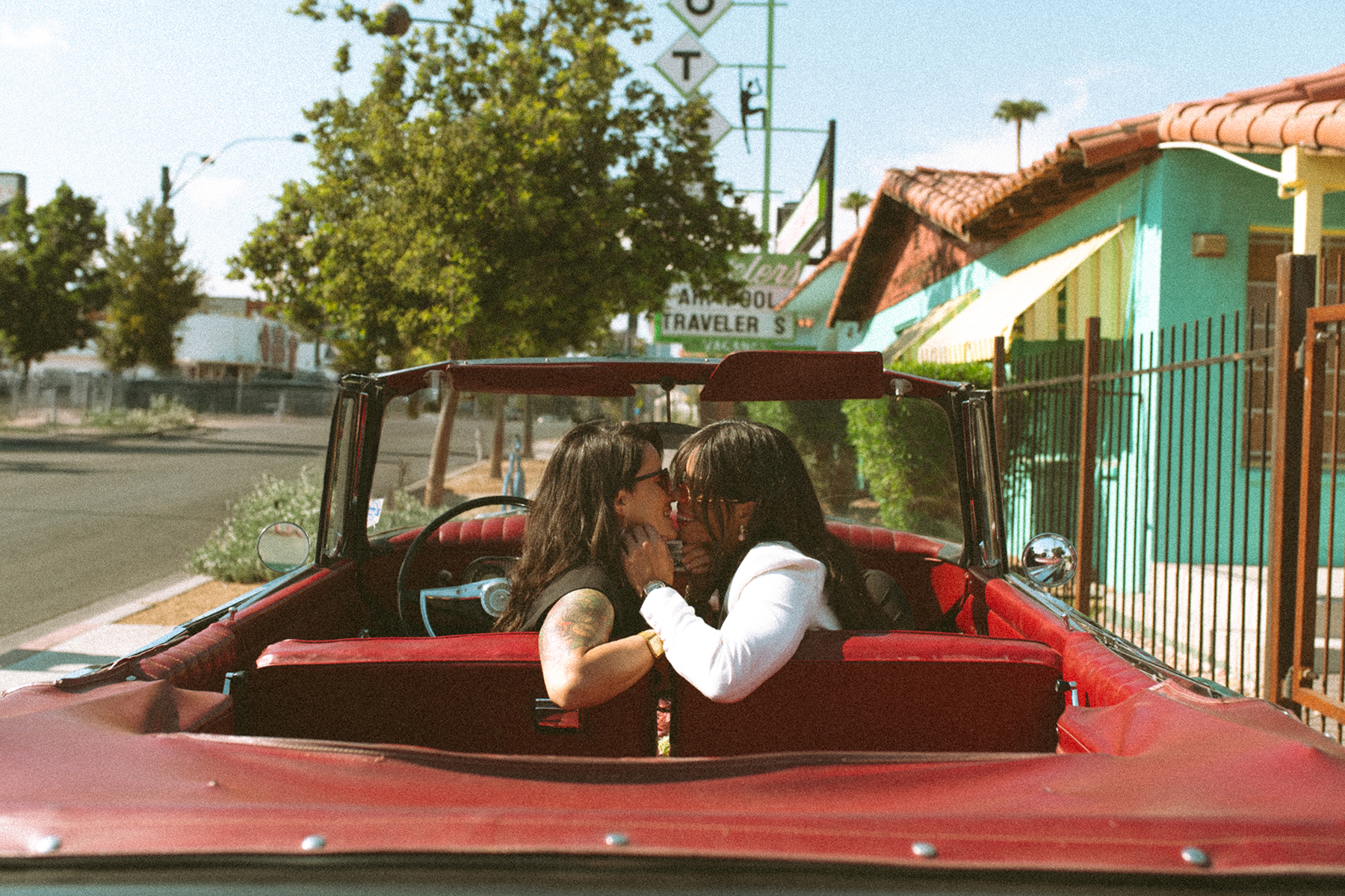 Lesbian couple inside vintage car at Las Vegas strip