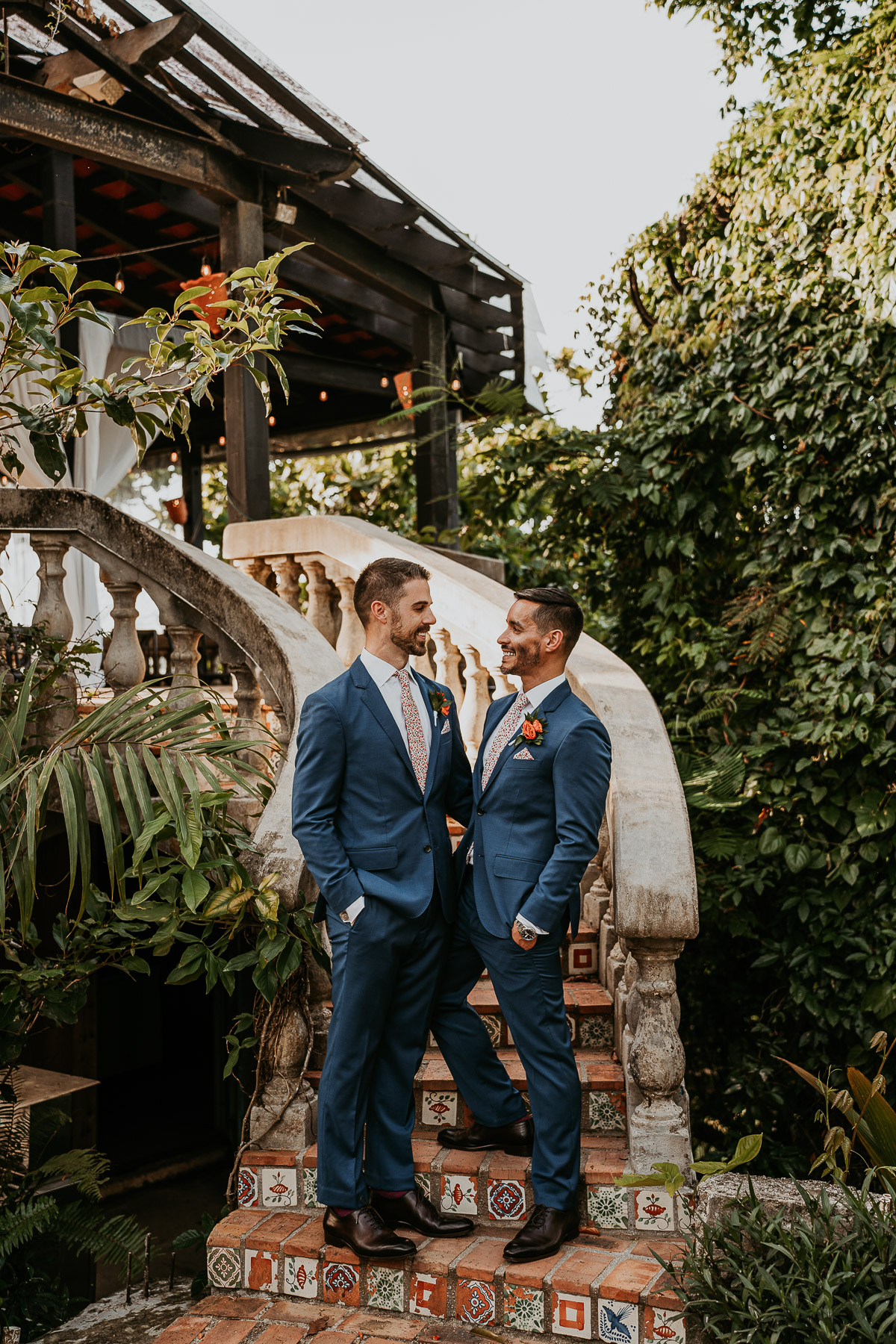 Couple at stairs of Hacienda Siesta Alegre during LGBTQ+ micro wedding