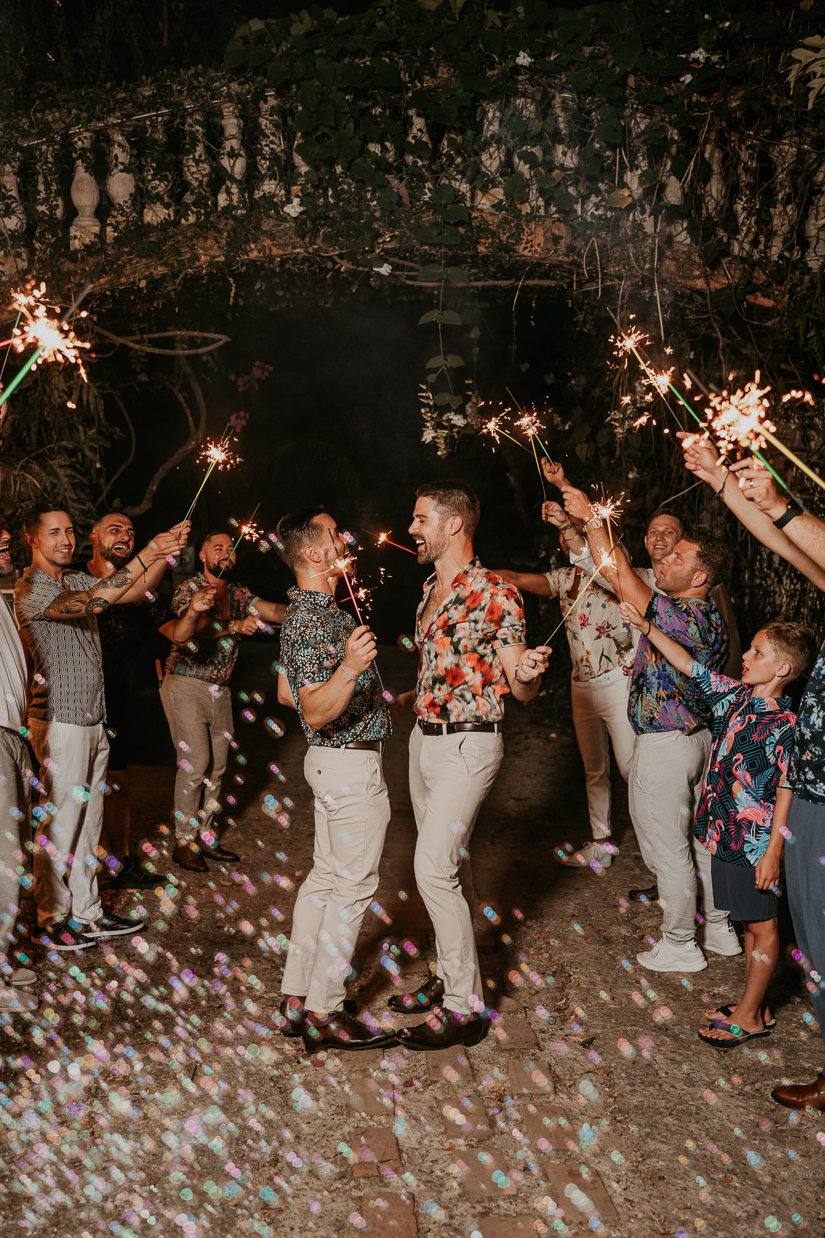 Sparklers under bridge at Hacienda Siesta Alegre LGBTQ+ wedding