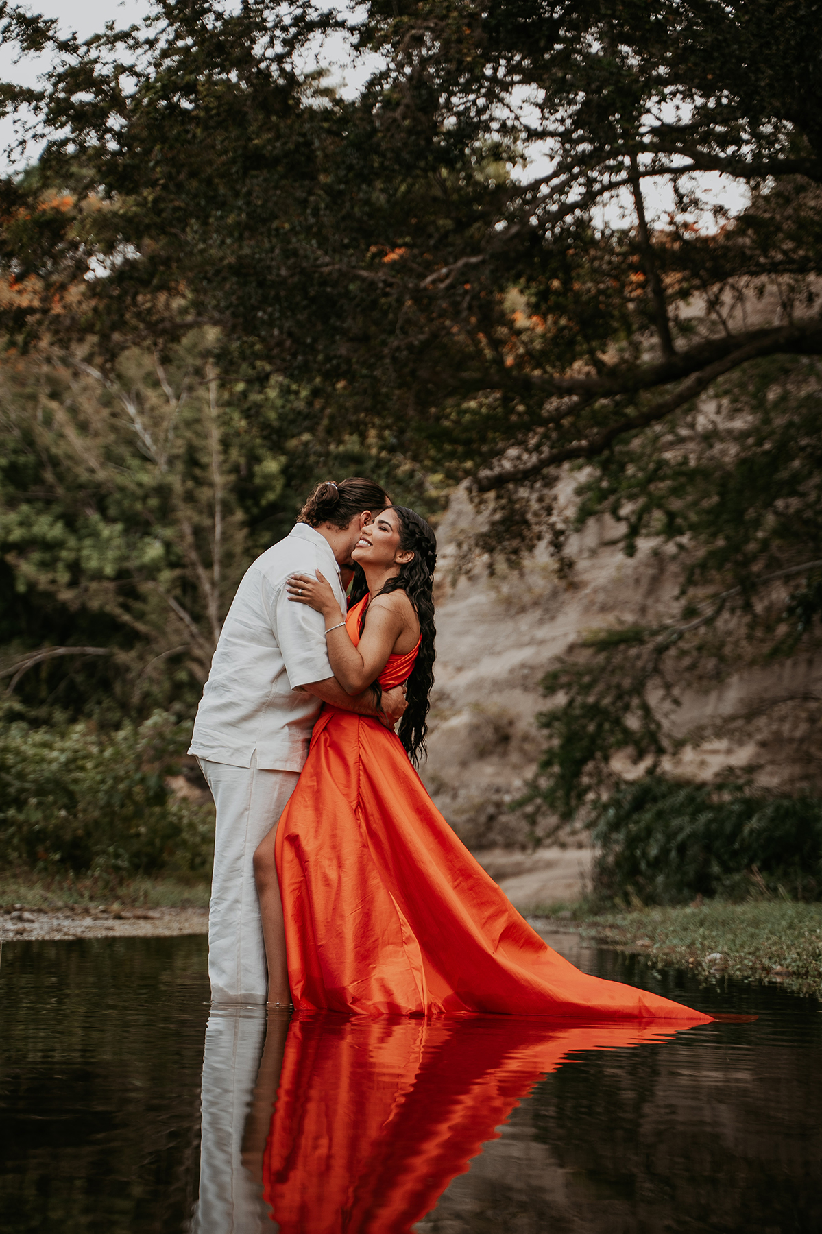 Couple exploring a secluded river location during an off-the-beaten-path adventure photo session in Puerto Rico
