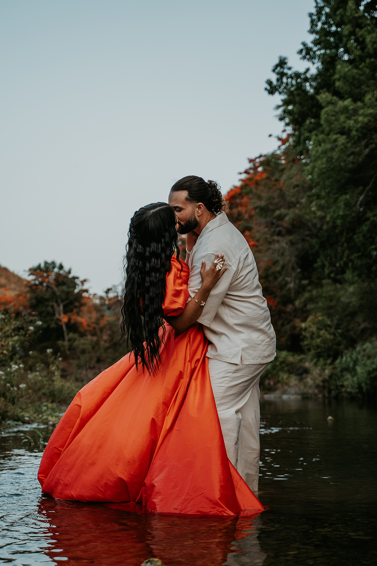 Intimate portrait of couple embracing in nature during an off-the-beaten-path Puerto Rico engagement session