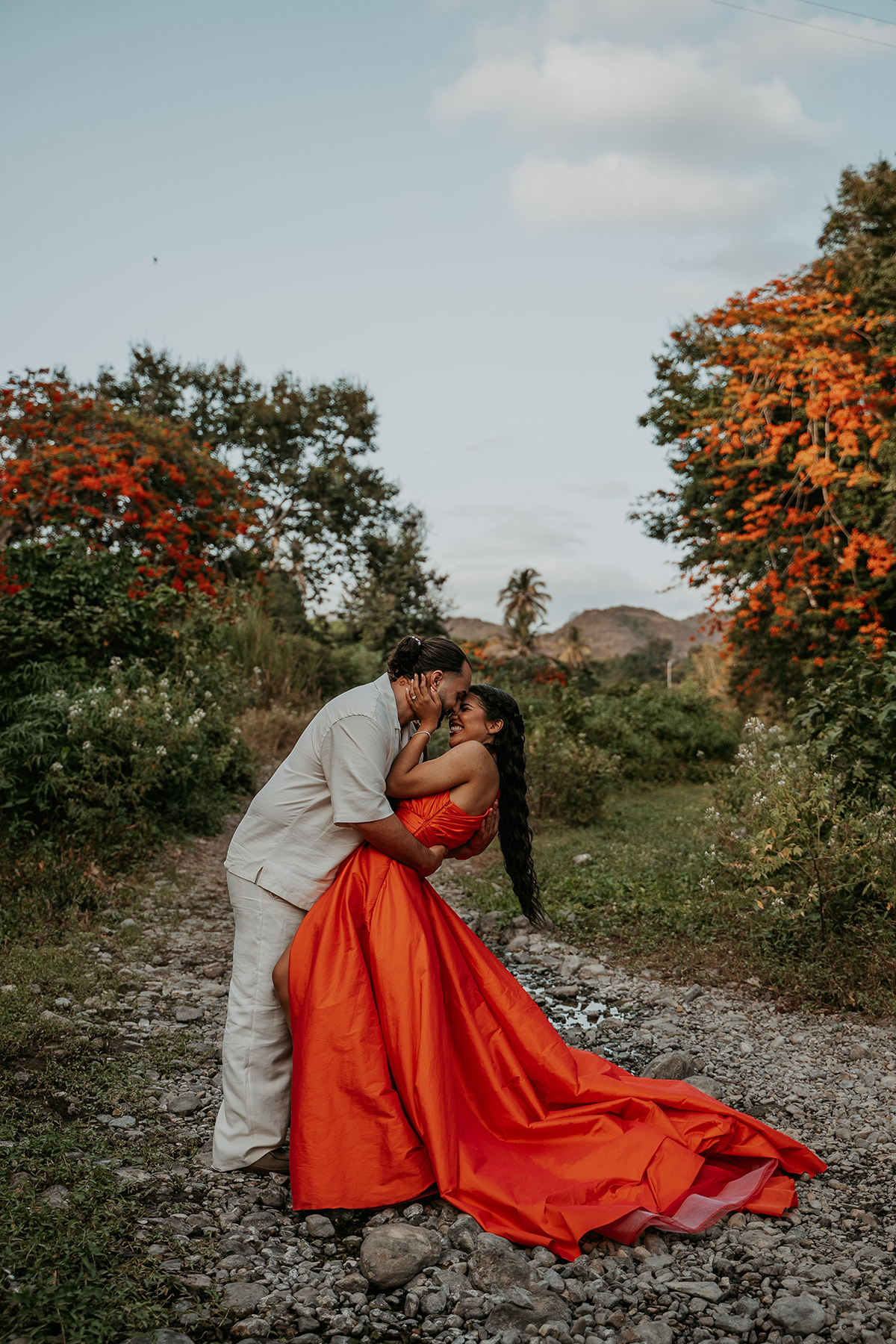 Candid moment of couple laughing together during an adventurous outdoor photo session in Puerto Rico