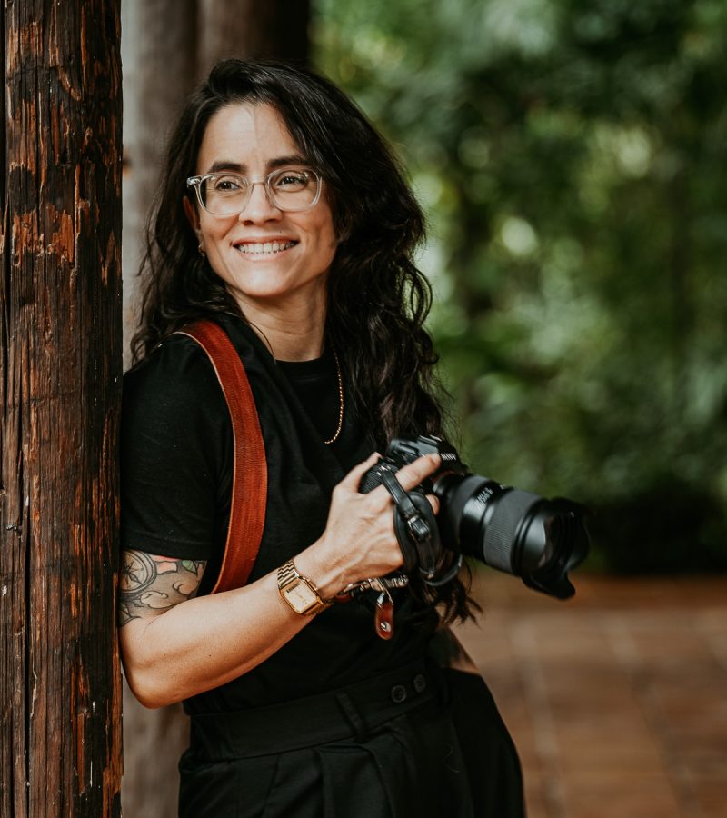Nilka, a queer-owned wedding photographer in Puerto Rico, capturing a candid moment at an elopement.