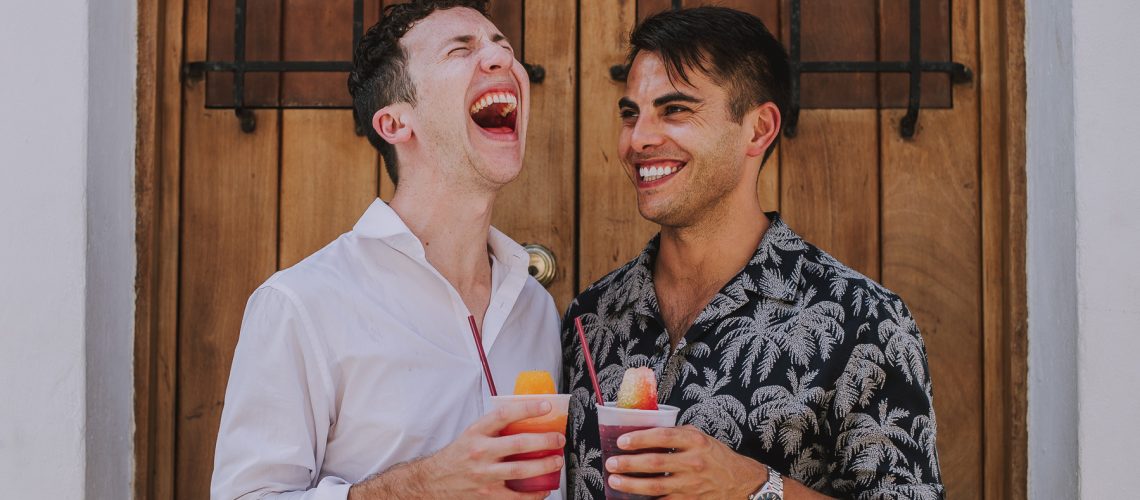 LGBTQ+ Couple Eating a Piragua at Old San Juan Engagement Session.